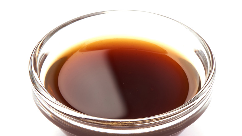 Worcestershire Sauce in a small bowl against white background