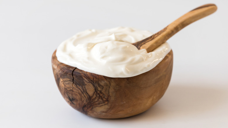 Greek yogurt in a wooden bowl