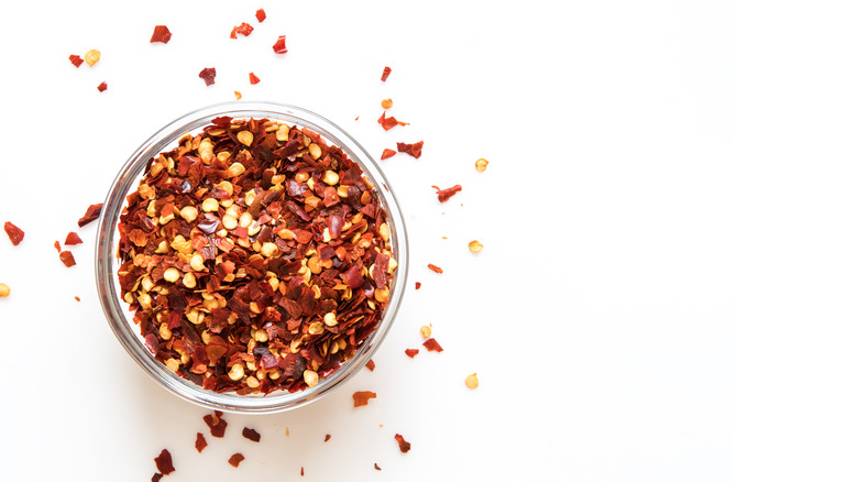 glass bowl of red chili flakes