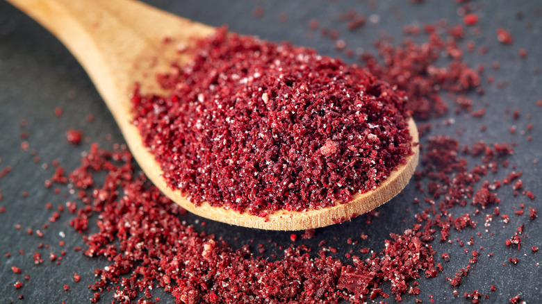 Sumac on a wooden spoon