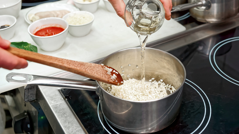 Stirring risotto on stove