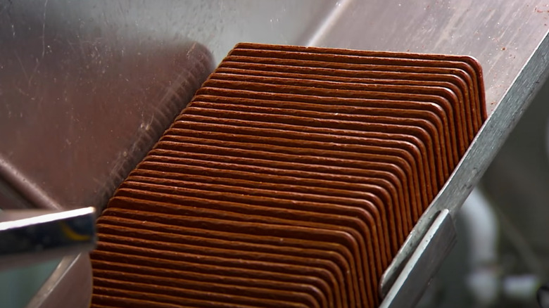 chocolate wafers on metal belt 