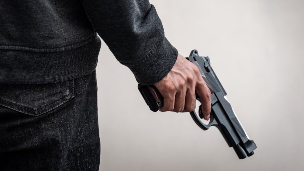 pizza delivery driver holding a gun 