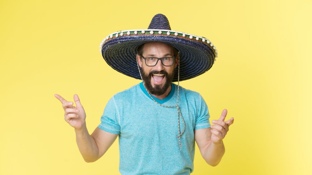 pizza delivery driver in a sombrero