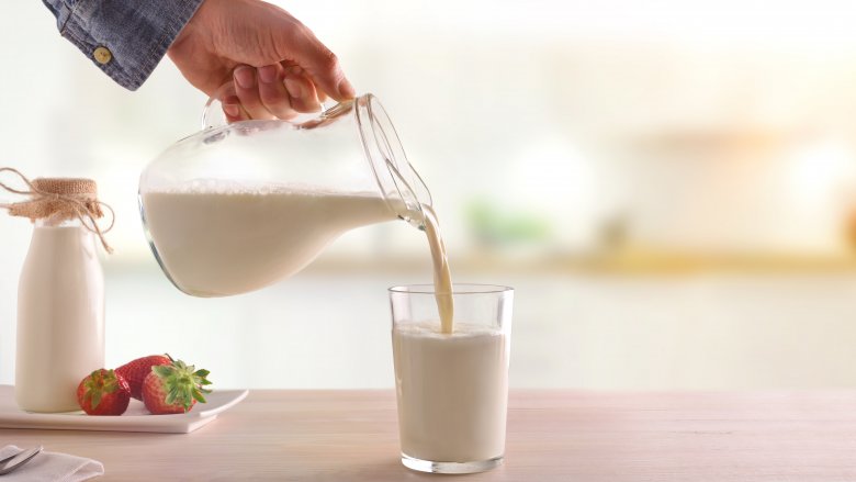 pouring a glass of milk