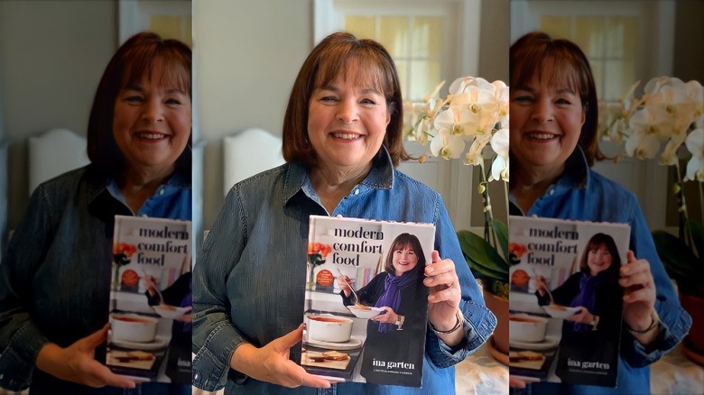 Ina Garten holding her cookbook