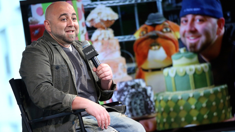 Duff Goldman speaking and sitting