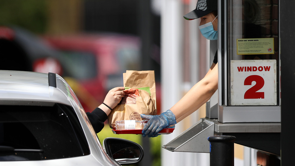 Driver collecting drive through order