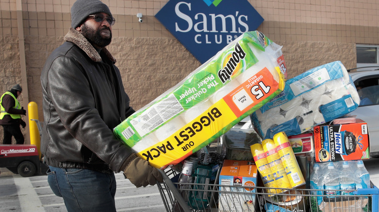 A consumer purchasing Sam's Club goods