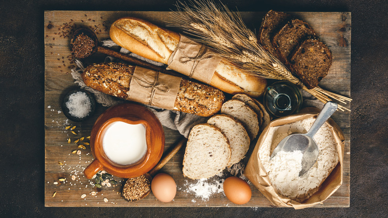 various breads and ingredients on cutting board