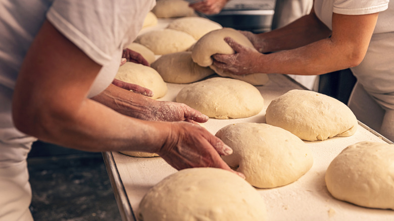 bakers shaping bread