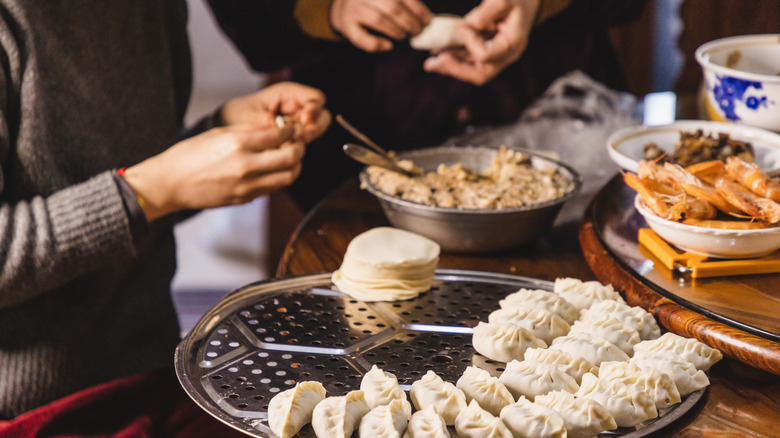 People making dumplings