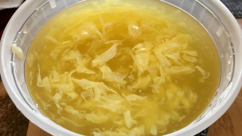 Egg drop soup in a container