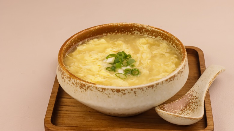 Soup in a bowl with a large spoon