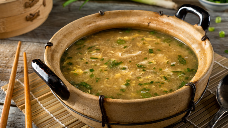 Egg drop soup in a wooden bowl