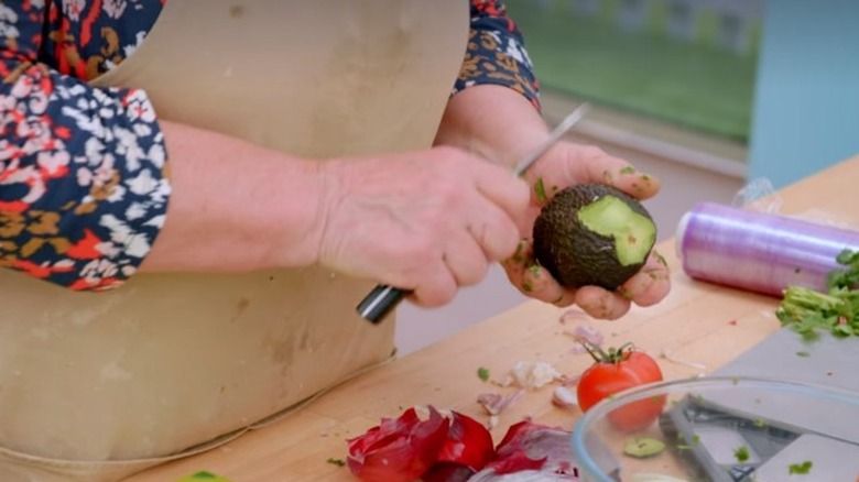 Carole peeling an avocado