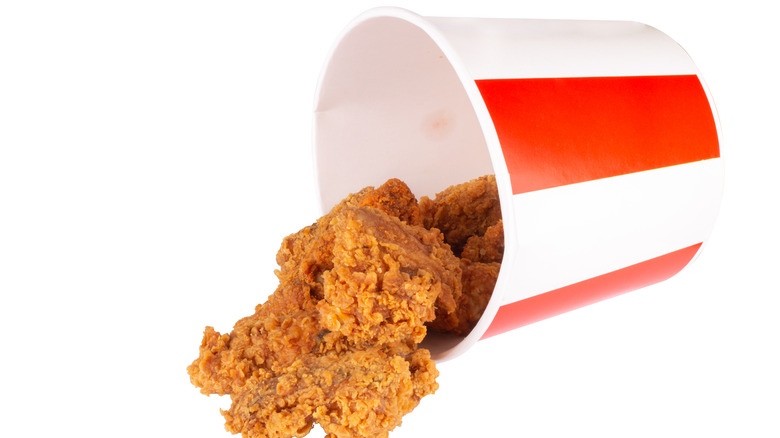 overturned greasy KFC chicken bucket