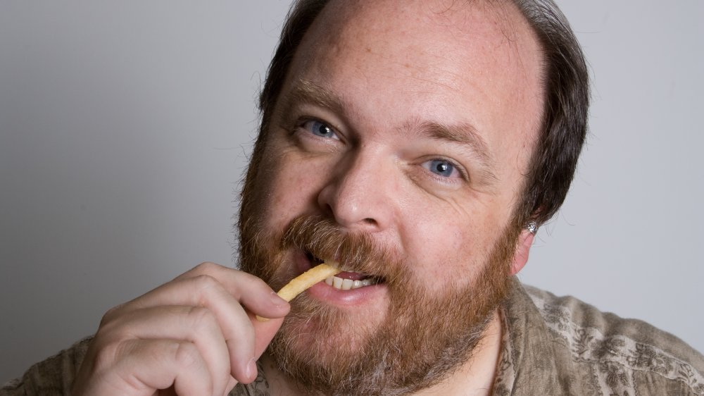 Balding man with fries