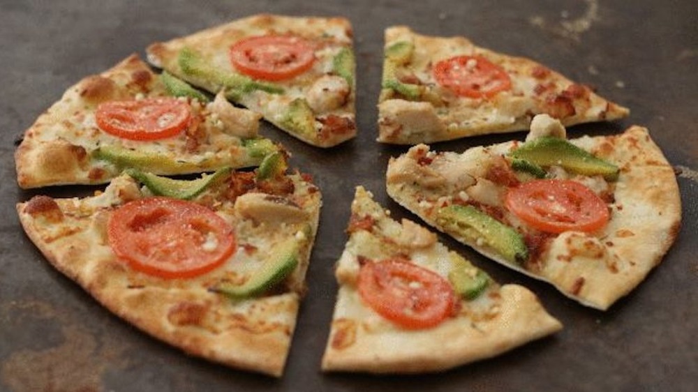 pizza slices sitting on flat surface