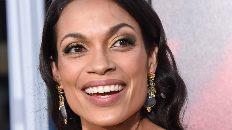 Rosario Dawson smiles in close-up