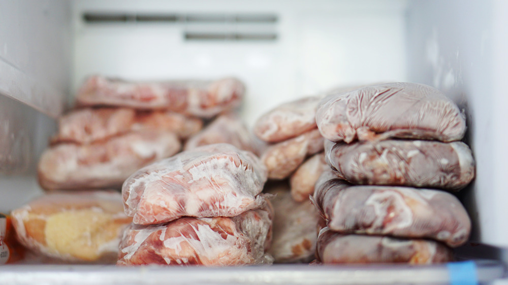 frozen chicken and meat in freezer