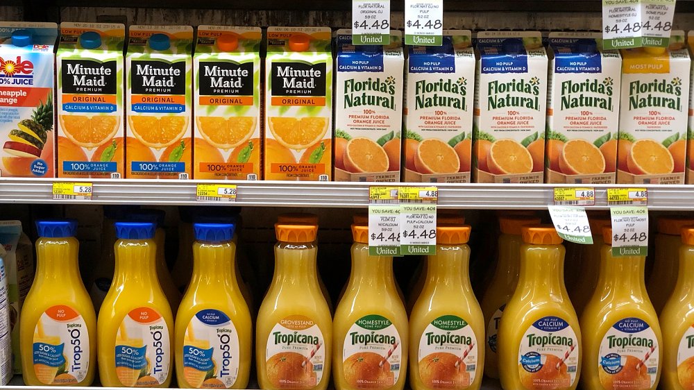 orange juice on grocery store shelves