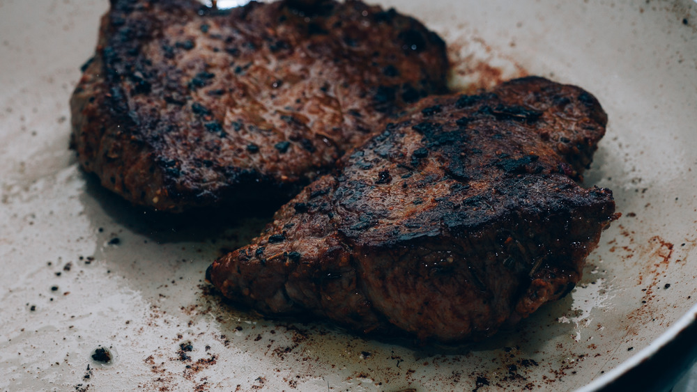 Burnt steak in afrying pan