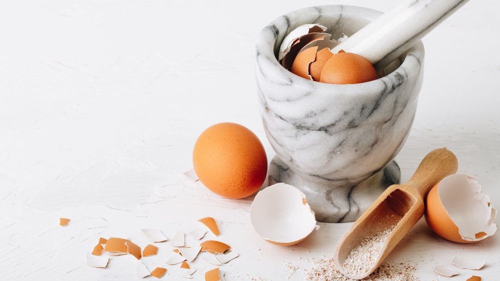 eggshells ground up in a mortar and pestle