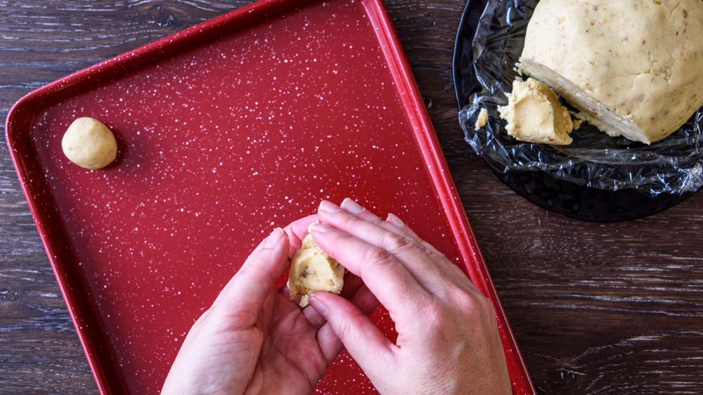 Rolling cookie dough balls