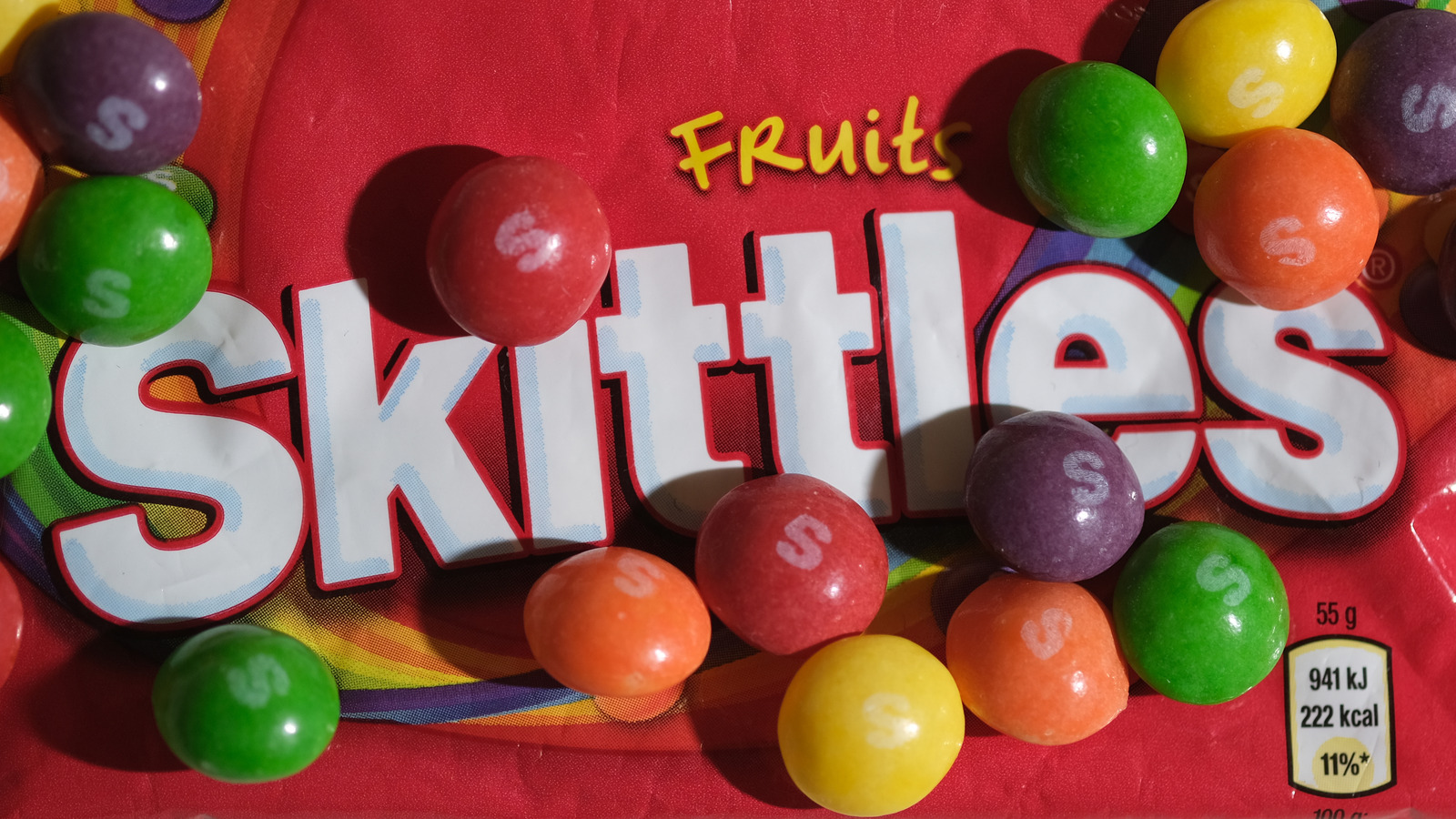 Here's Why You're Seeing All White Packets Of Skittles