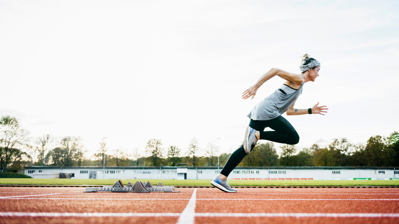 woman running on track