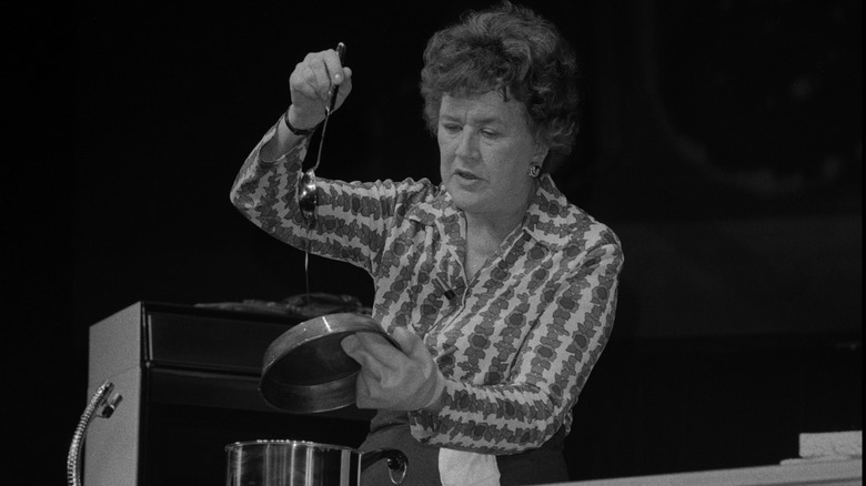 Julia Child cooks in vintage black-and-white photo