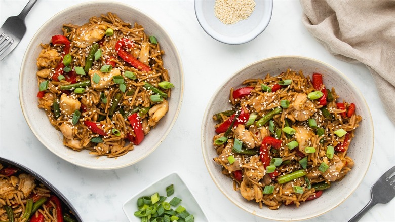bowls of noodles with chicken