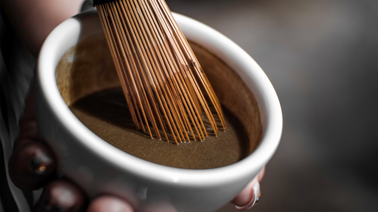 Hojicha being whisked in a bowl