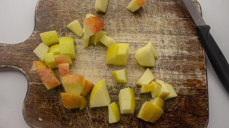 cubed apple on cutting board 