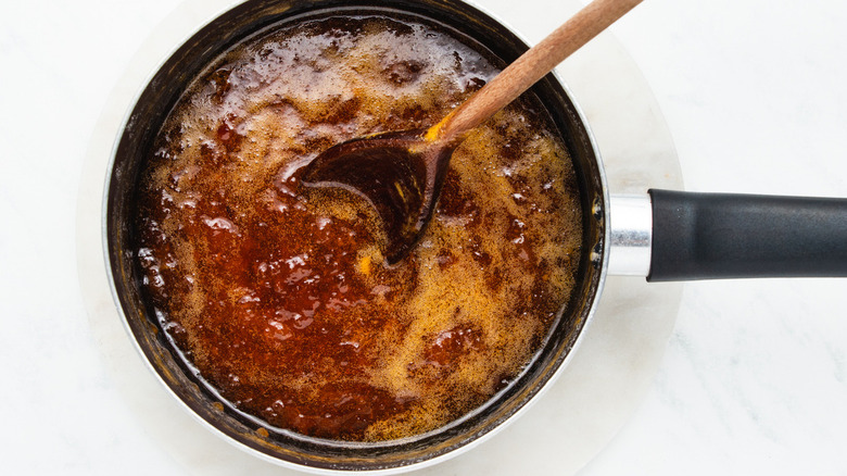 spoon in pot of jam