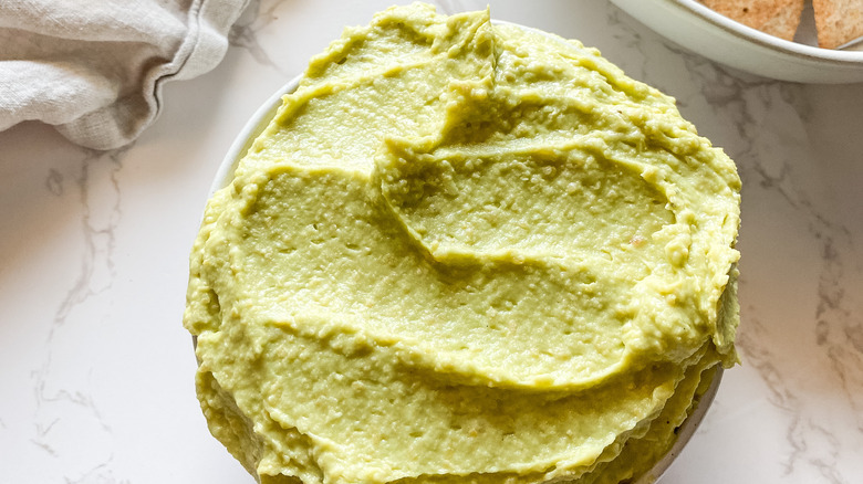 Avocado hummus in a small bowl