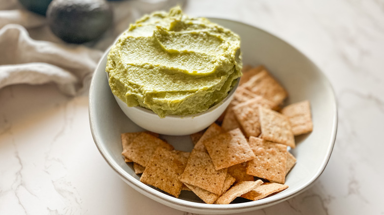 hummus avocado in serving bowl