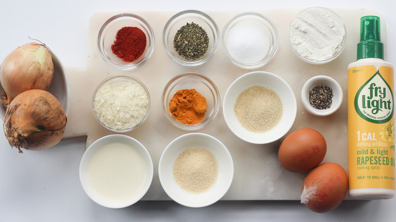 Different kinds of ingredients placed in small bowls on the table.