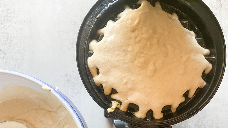 waffle batter in waffle iron