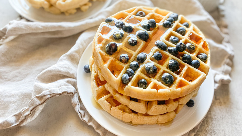 stack of waffles with syrup