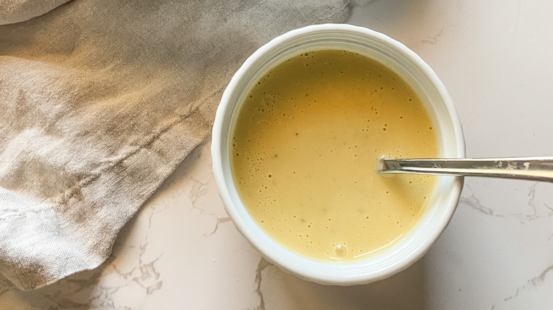 A serving of Caesar dressing in a bowl