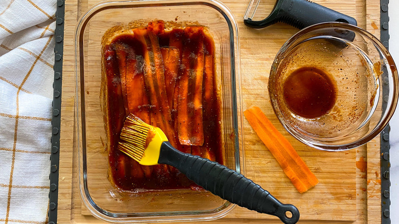 carrot bacon slices marinating in dish