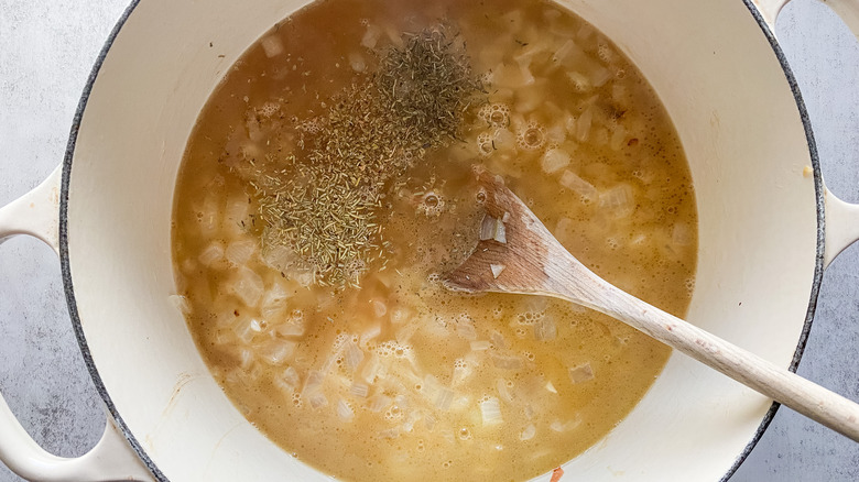 A pot of soup ready to simmer