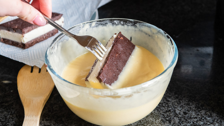 Dipping ice cream sandwiches into batter