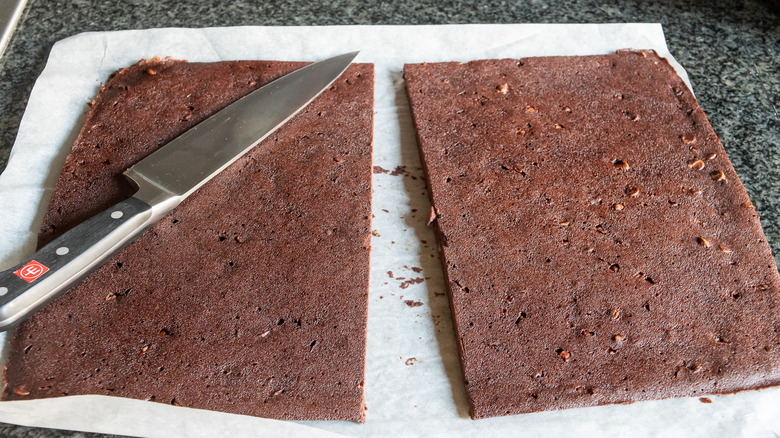 Thin brownie layer sliced in half