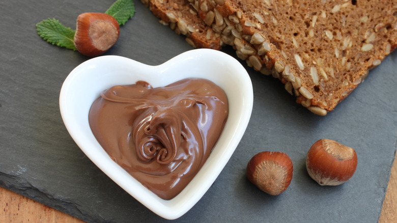 hazelnut nutella chocolate dip in heart-shaped dish