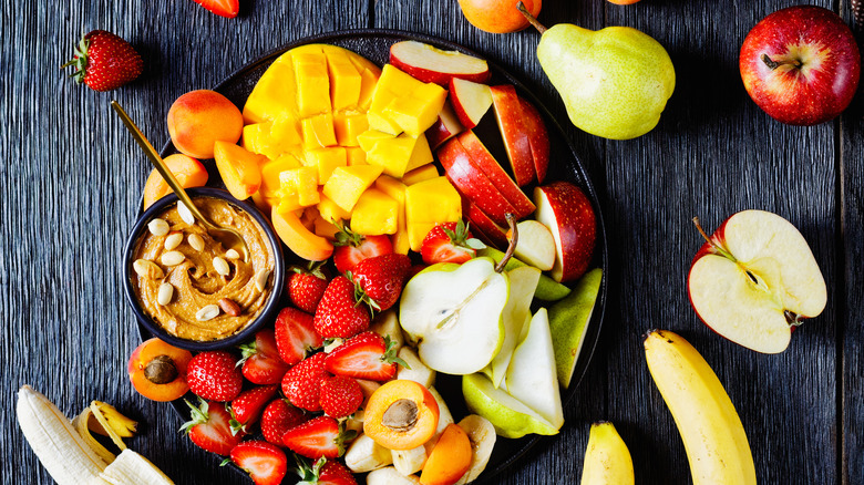 Peanut butter dip with various fresh fruits