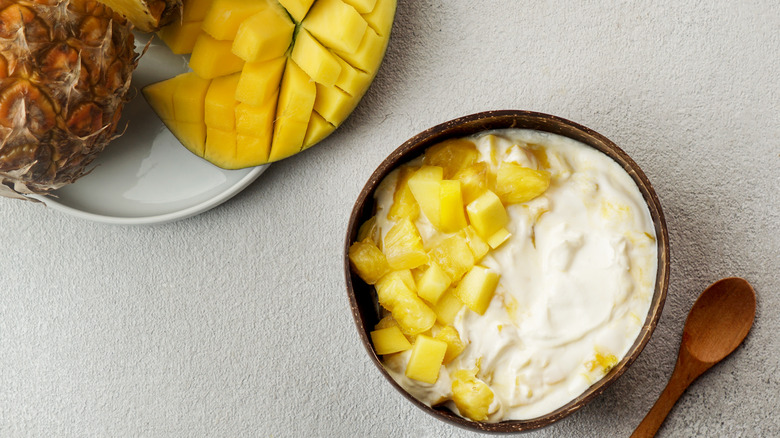 pineapple coconut cream combination  in wooden bowl