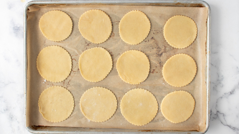 empanada dough discs on tray